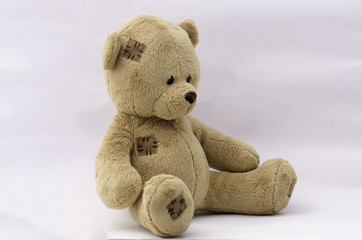 Brown teddy bear on white background.