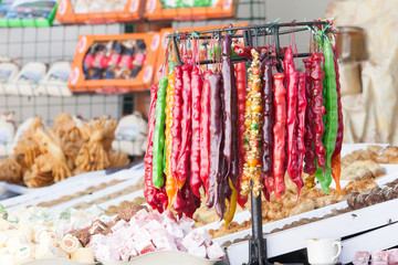 The hanging linking of beautiful multi-colored tasty churchkhela