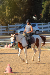 girl is riding a horse