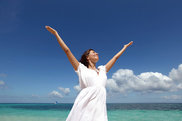 Woman in dress on beach