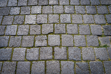 Stone paving dark texture. Abstract structured background.