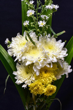 bindel of mix flowers for praying on black background