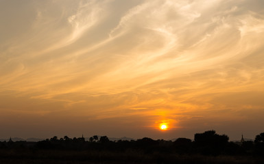 Sunset with abstract flame shape cloud and colorful twilight sky background in Old Bagan, Myanmar