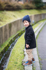 asian child playing in the park