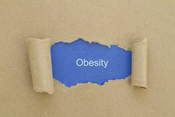 Obesity written under torn paper.