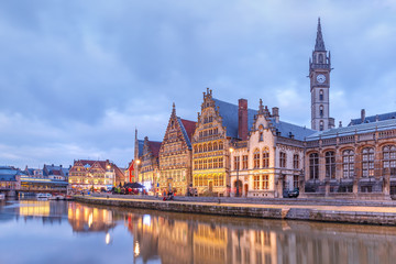 Picturesque medieval buildings on the quay Graslei and Leie river at Ghent town in the evening, Belgium