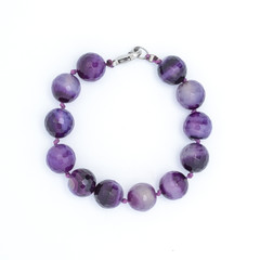 Bracelet with purple beads isolated
