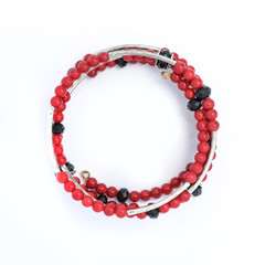 Obraz premium Bracelet with red beads stones isolated