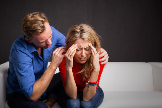 Man trying to calm his girlfriend down