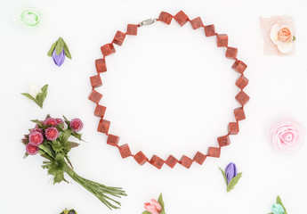 beads and flowers on white