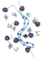 beads and flowers on white
