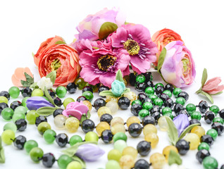 Fototapeta premium beads and flowers on white