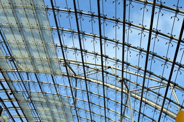 glass roof of an exhibition hall with blue sky