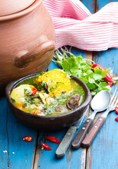 Latin american food. Cazuela - traditional chilean soup served in clay plate from pomaire