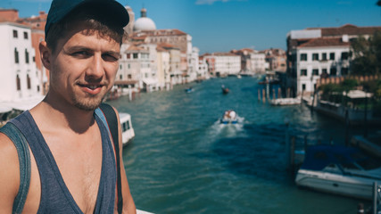 Fototapeta na wymiar Man making a selfie on Venice Grand canal