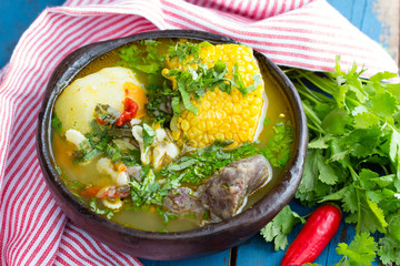 Latin american food. Cazuela - traditional chilean soup served in clay plate from pomaire