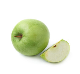 Green apple next to a slice isolated