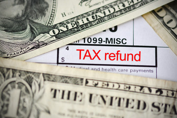 Claim a tax refund concept with form template close up