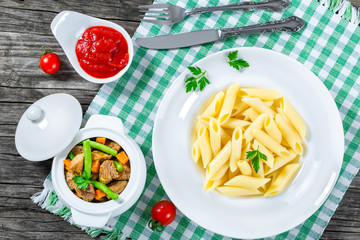 italian pasta penne and stewed meat