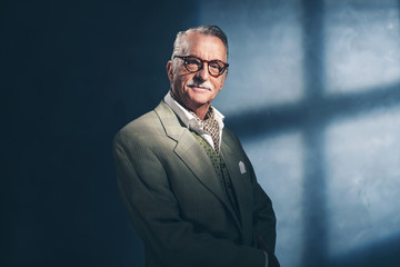 Serious retro 40s senior businessman. Studio shot.