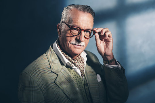 Serious retro 40s senior businessman. Studio shot.