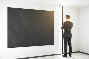 Blackboard and thinking man