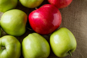 Apples are on the table, covered sackcloth