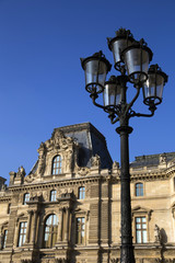 Public lamp and old building in Paris