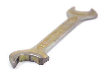 Broken wrench on a white background with small depth of field