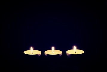 three candles burning