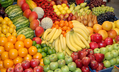 Close up of many colorful fruits on market stand