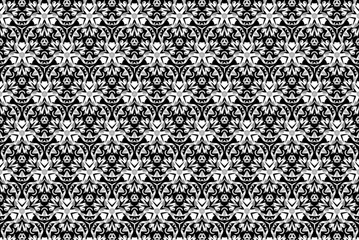 Black-and-white ornament with different elements. 
z