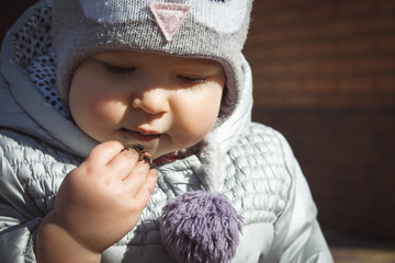 Portrait of toddler tasting soil 