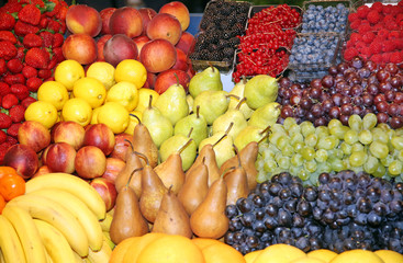 Close up of many colorful fruits on market stand