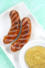 Fried sausage on white plate