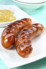 Fried sausage on white plate