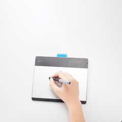 Hand drawing or retouching image, using a digital tablet and stylus pen.Copy space in foreground
