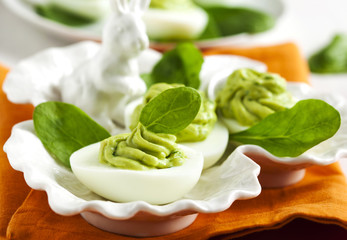 Deviled eggs with avocado and spinach