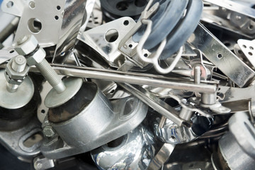 Heap of mounting hardware on stand close up