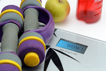 scales, apple and dumbbells
