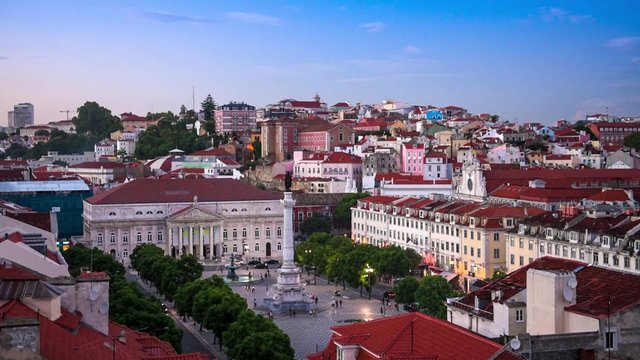 Lisbon, Portugal city skyline over Rossio Square at night.