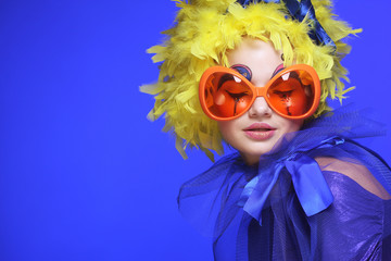 woman with yellow  hair and carnaval glasses