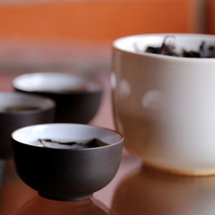 Chinese Tea Being Served in Chinese Tea Cups