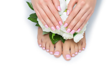 Woman hands and feet with french manicure
