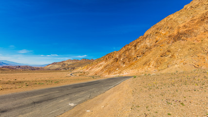 Artist drive turns into a narrow and winding road. The one-way road is great and offers majestic views. It contains colorful rock formations. Artist's Drive, Death Valley National Park
