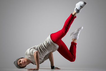 Young break-dancer doing handstand