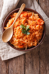 Greek food lahanorizo rice with cabbage in a bowl. vertical top view