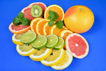 Fresh citrus isolated on blue background