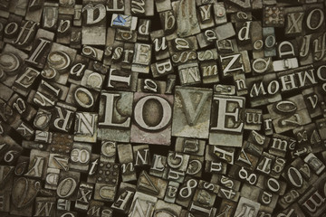 Close up of typeset letters with the word Love