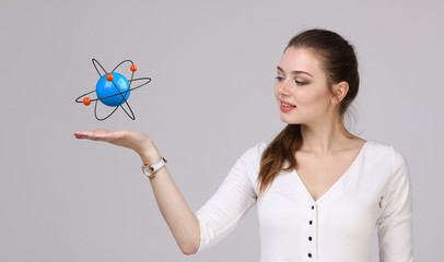 Woman scientist with atom model, research concept